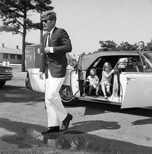 12 Aug 1963, Cape Cod, Massachusetts, USA --- President John F. Kennedy walks out of a car with his children Caroline and John Jr. following him toward a hospital where they are visiting his wife and the children's mother, Jacqueline Kennedy. --- Image by © Bettmann/CORBIS