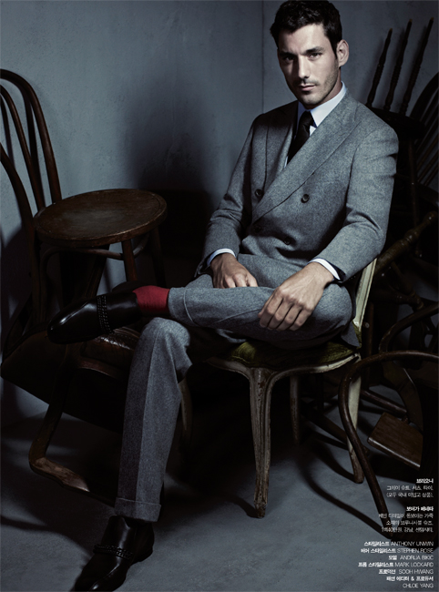 gentleman-swagger-sitting-down-pink-socks-grey-suit